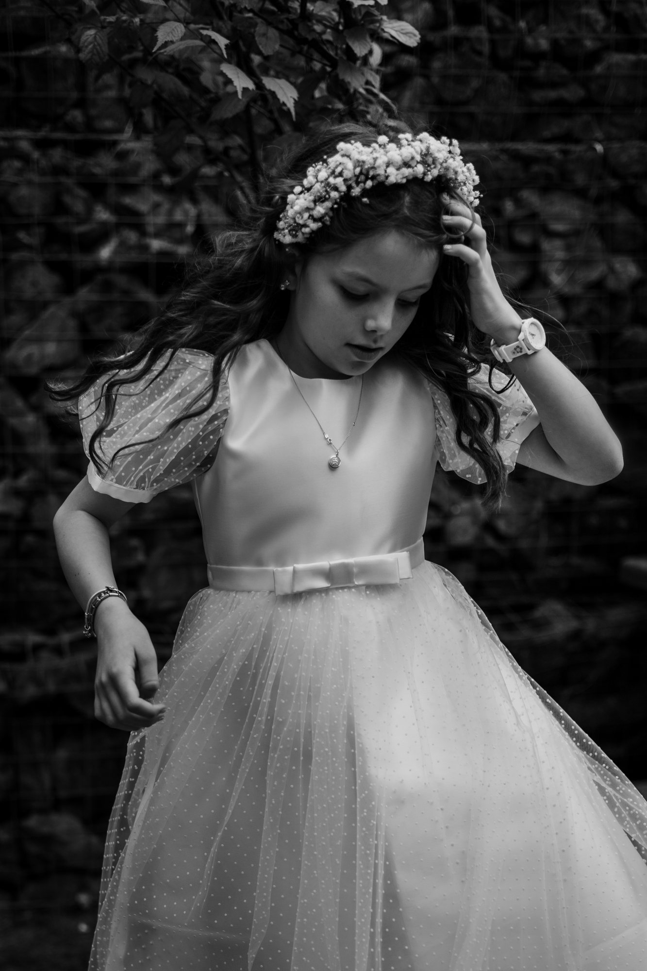 Young girl in a flower crown photographed in monochrome